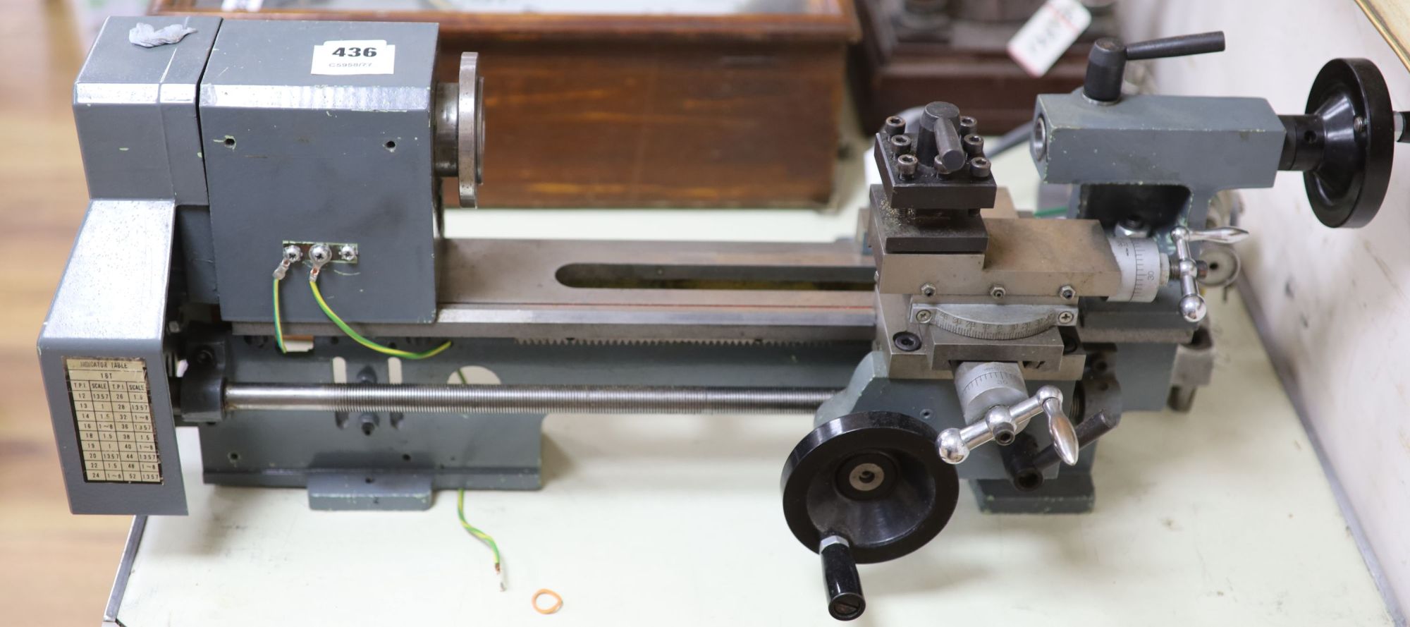 Clockmakers tools - a grey painted lathe with stud gear box, no makers mark, 71.5cm long